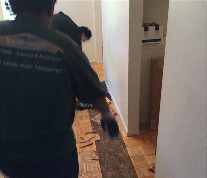 strip of parquet removed for drying of subfloor
