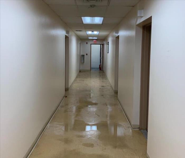 Office hallway with standing water